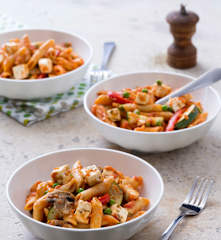 Tomato pasta with vegetables and feta