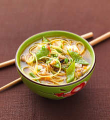 Chinese egg noodle soup with mixed mushrooms