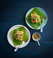 Steamed sea bass wrapped in banana leaves with green mango salad (Luke Nguyen)