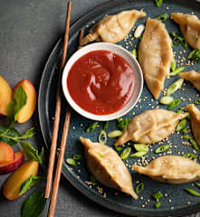 Steamed Duck Dumplings with Sticky Plum Dipping Sauce
