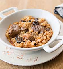 Arroz con setas de temporada, pato y trufa