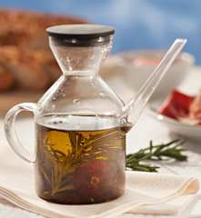 Aceite con tomates secos, romero y tomillo